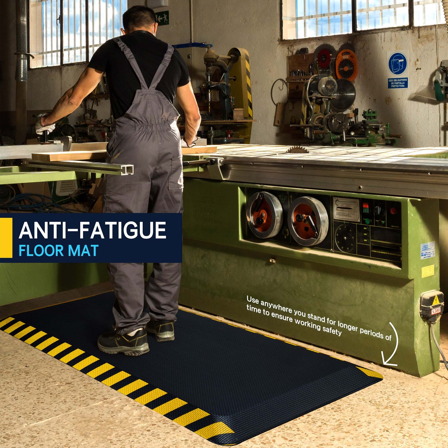 Worker standing on black anti-fatigue mat with yellow border at woodworking workstation in industrial workshop