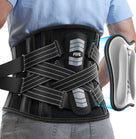 FEATOL back brace with X-strap compression system, showing removable ergonomic lumbar pad being pulled out from brace pocket with blue highlight, FEATOL logo visible on upper and lower lumbar pads