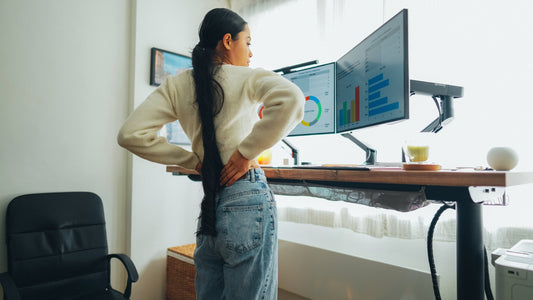 Office worker experiencing foot and back pain from standing on hard floors all day