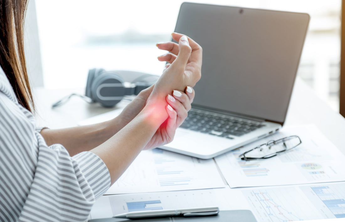 Person experiencing wrist tendonitis pain highlighting the need for targeted wrist support and recovery