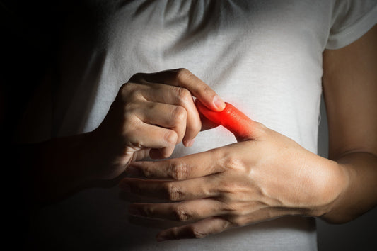Hands with red glowing thumb joint indicating inflammation pain from thumb arthritis or De Quervain's tenosynovitis