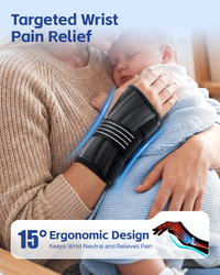 Mother holding baby while wearing 15° ergonomic wrist brace, easing wrist pain during childcare.