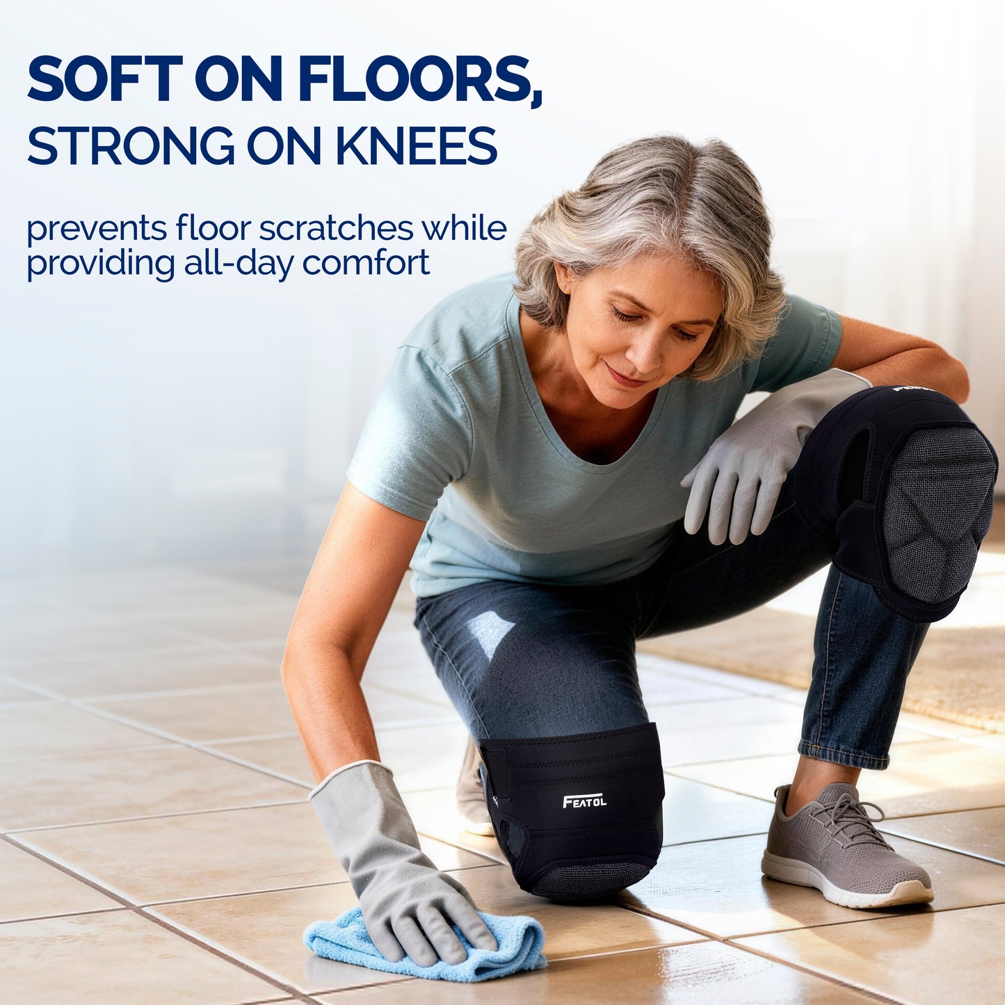 Woman kneeling on tile floor while cleaning, wearing FEATOL knee pads that protect knees and prevent floor scratches during household tasks