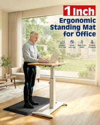 Man working at standing desk on FEATOL 1-inch ergonomic mat, relieving ankle, knee, and back pressure.