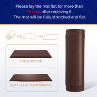 Brown FEATOL anti-fatigue standing mat shown rolled with diagram and instruction to lay flat for 96 hours after receiving, showing mat comes rolled and gradually flattens for optimal use