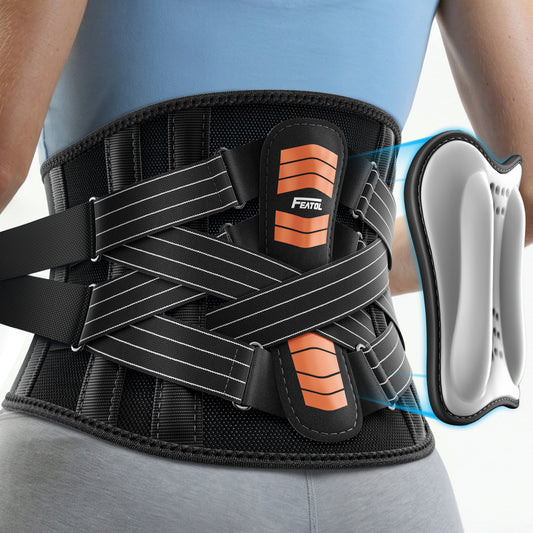 FEATOL back brace worn from behind, showing X-compression straps and removable orange lumbar pad.