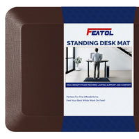 FEATOL brown standing desk anti-fatigue mat displayed next to product packaging box showing high-density foam provides lasting support and comfort, perfect for office and home use