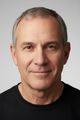 Smiling male customer with gray hair wearing a black t-shirt, featured in a FEATOL product review
