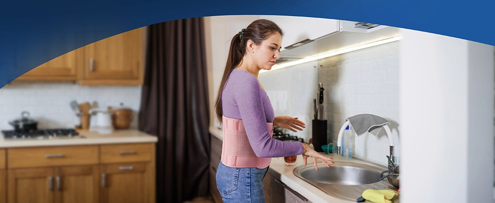 pink back brace for pain relief while doing chores and standing for women