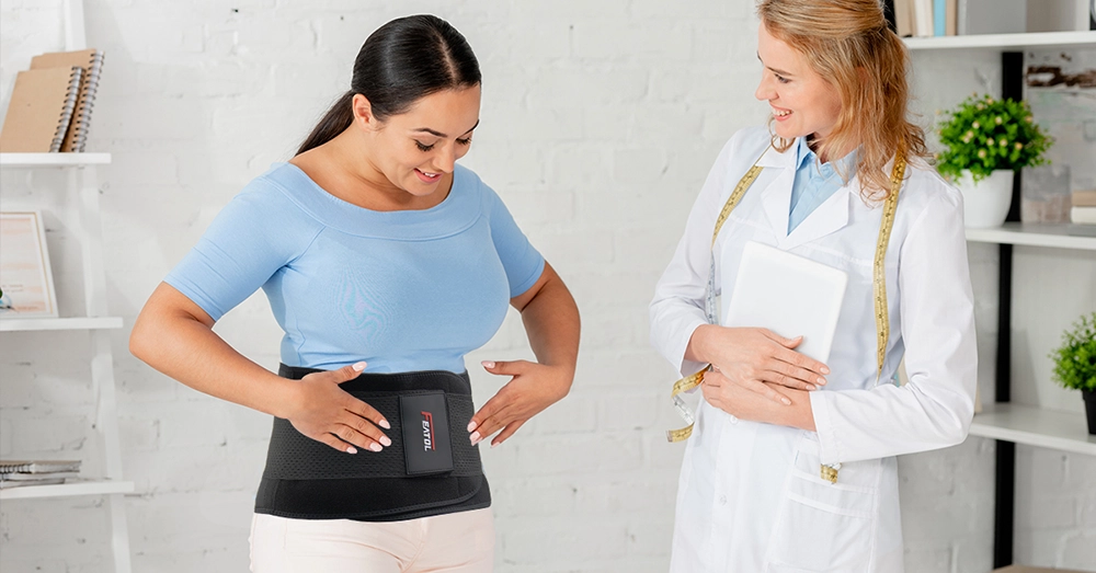 Patient wearing a FEATOL back brace during a rehabilitation consultation with a doctor